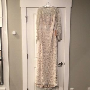 Beautiful Tadashi Shoji cream lace wedding dress with blush underlay.